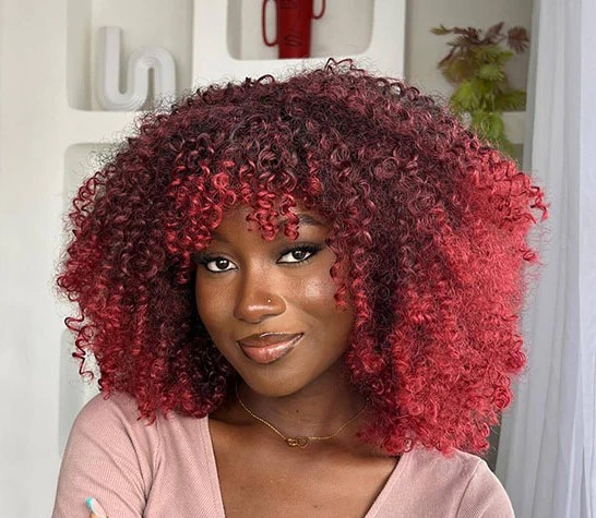 Young woman with cherry hair colr
